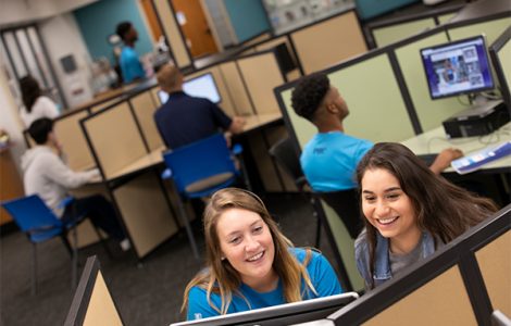 Female students working at computer