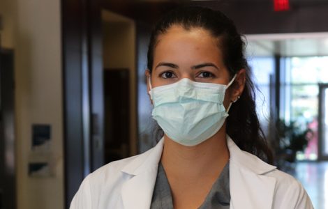 Student wearing a mask on campus