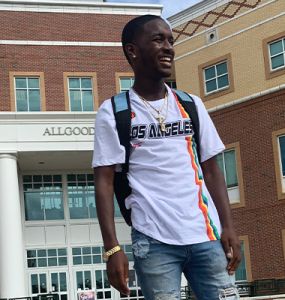 Student smiling on college campus
