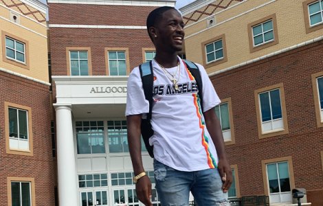 Student smiling on college campus